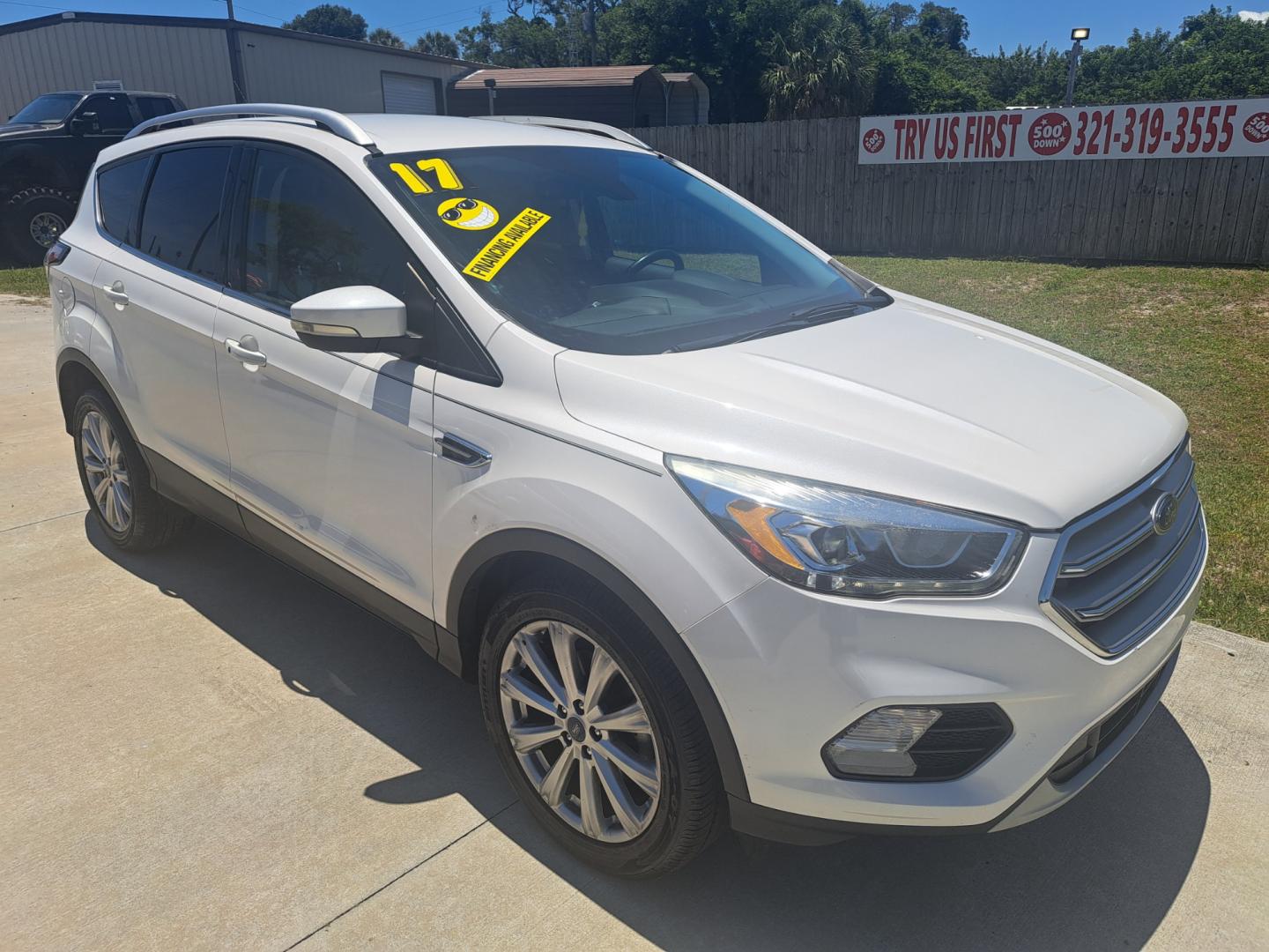 2017 White Ford Escape Titanium FWD (1FMCU0JD8HU) with an 1.5L L4 DOHC 16V engine, 6A transmission, located at 1181 Aurora Rd, Melbourne, FL, 32935, (321) 241-1100, 28.132914, -80.639175 - Photo#2